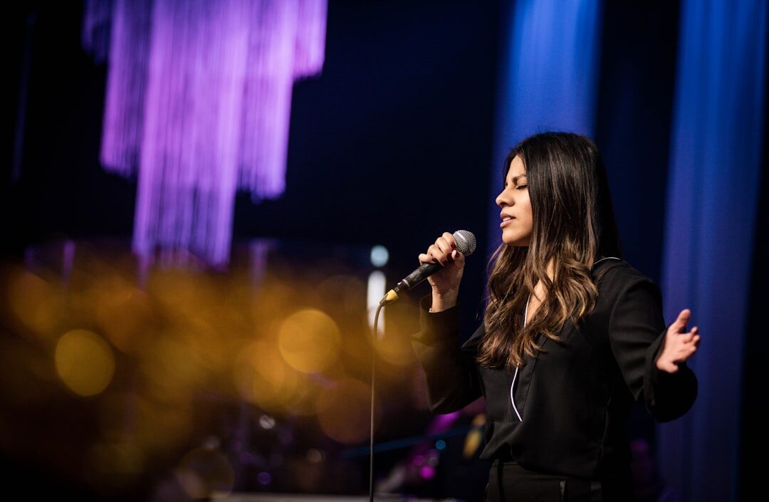 woman singing on stage